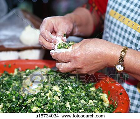 A woman making dumpling View Large Photo Image Picture - A woman making dumpling. Fotosearch