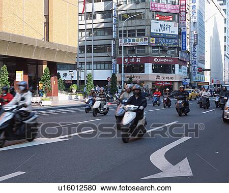 Stock Image - Commuters on bikes, Taipei, Taiwan. Fotosearch