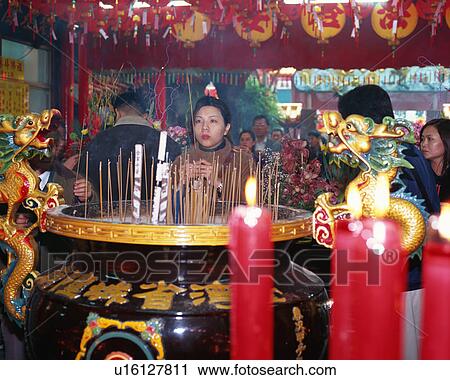 People praying at temple View Large Photo Image Stock Image - People praying at temple. Fotosearch