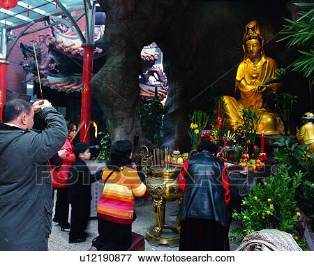 People praying at temple View Large Photo Image Stock Photo - People praying at temple. Fotosearch