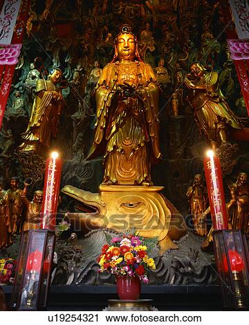 Stock Image - Golden statue in Jade Buddha Temple, Shanghai, China. Fotosearch