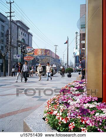 Stock Photo - People walking in street, Shanghai, China. Fotosearch
