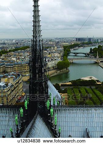 Stock Photo - Notre Dame Overlooking the Seine River. Fotosearch
