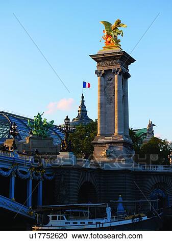 Stock Image - Pont Alexandre III Tower and Grand Palais. Fotosearch