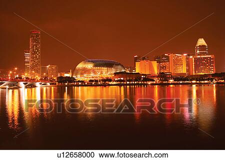 Stock Image - Singapore River and Esplanade Theater at night, Singapore. Fotosearch