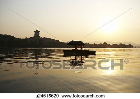 The Six Harmonies Pagoda and small boat, West Lake in Hangzhou, Zhejiang Province, People Republic of China View Large Photo Image Stock Image - The Six Harmonies Pagoda and small boat, West Lake in Hangzhou, Zhejiang Province, People Republic of China. Fotosearch