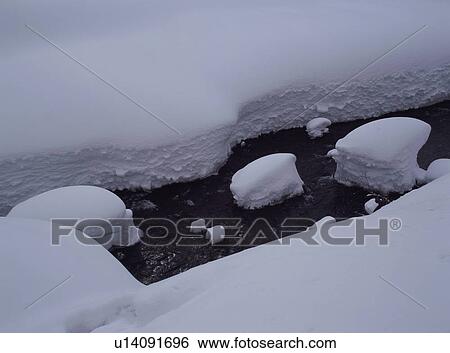 Stock Photograph - Snow covered land and river. Fotosearch