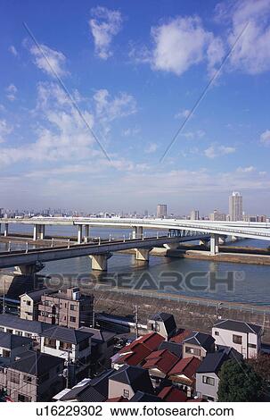 Stock Image - Elevated road over river, Tokyo, Japan. Fotosearch