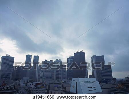 Stock Photograph - Skyline of Shinjuku on cloudy day. Fotosearch