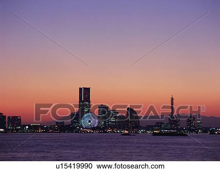 Stock Image - Skyline of Yokohama at dusk. Fotosearch