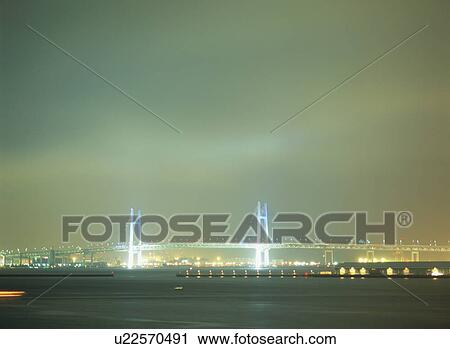 Stock Image - Yokohama Bay Bridge at night. Fotosearch