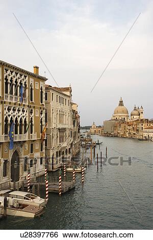Buildings and boats on canal in Venice, Italy. View Large Photo Image Stock Photograph - Buildings and boats on canal in Venice, Italy.. Fotosearch