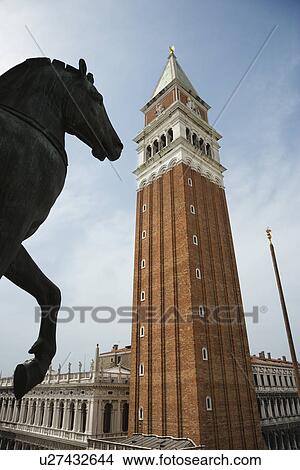 Horse statue and Campanile in Piazza San Marco in Venice, Italy. View Large Photo Image Picture - Horse statue and Campanile in Piazza San Marco in Venice, Italy.. Fotosearch