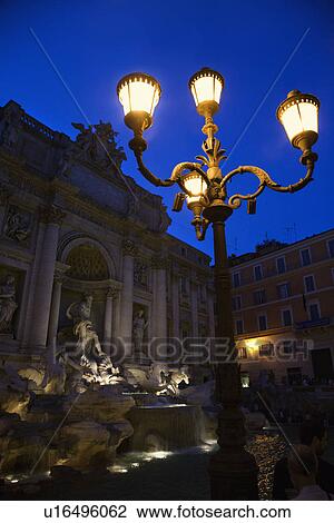 Stock Image - Trevi Fountain in Rome, Italy lit up at night.. Fotosearch