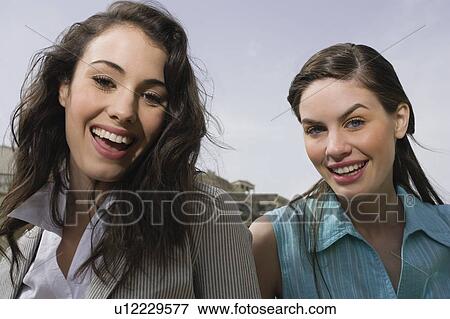 Stock Photo - Two women smiling. Fotosearch