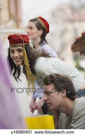 Woman wearing Greek costume hat View Large Photo Image Stock Image - Woman wearing Greek costume hat. Fotosearch