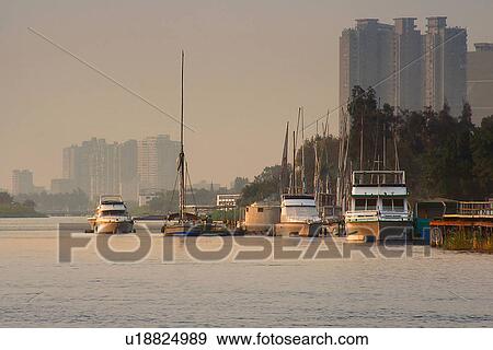Stock Photo - Egypt, Cairo, Cityscape, Nile, Boats. Fotosearch
