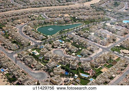 Stock Photograph - dubai, emirates, hills, springs, medows, homes. Fotosearch