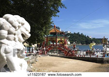 Lion sculpture and a red pavilion on Repulse Bay, Hong Kong View Large Photo Image Stock Photo - Lion sculpture and a red pavilion on Repulse Bay, Hong Kong. Fotosearch