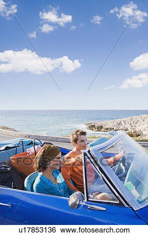 Man and woman in car by sea. View Large Photo Image Stock Photograph - Man and woman in car by sea.. Fotosearch