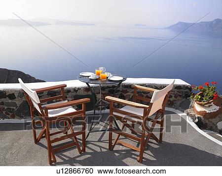 Stock Image - Breakfast set up, sea view. Fotosearch