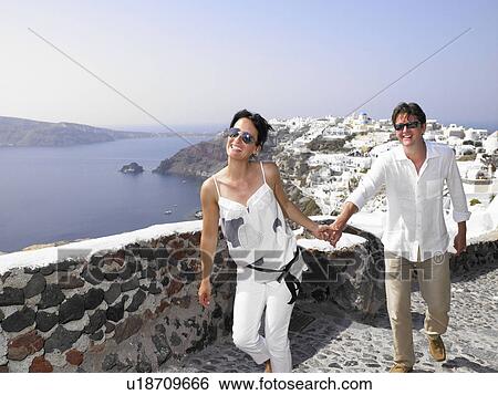 Stock Photograph - Couple climbing the stairs. Fotosearch