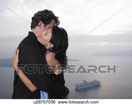 Couple hugging, sea view View Large Photo Image Stock Photograph - Couple hugging, sea view. Fotosearch