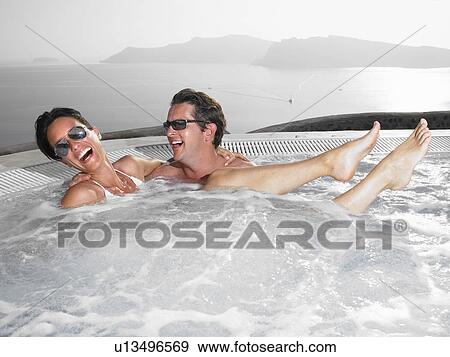 Stock Photo - Couple in hot tub. Fotosearch