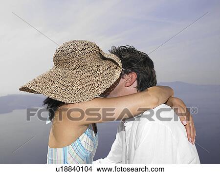 Couple kissing, sea view View Large Photo Image Picture - Couple kissing, sea view. Fotosearch