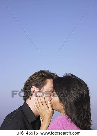 Stock Photography - Couple kissing. Fotosearch