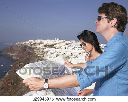 Stock Photography - Couple looking at a map. Fotosearch