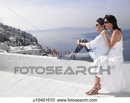 Couple looking at the sea view View Large Photo Image Stock Image - Couple looking at the sea view. Fotosearch