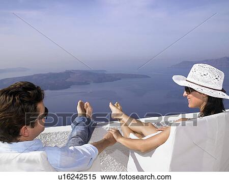 Couple looking at the sea view View Large Photo Image Stock Photography - Couple looking at the sea view. Fotosearch