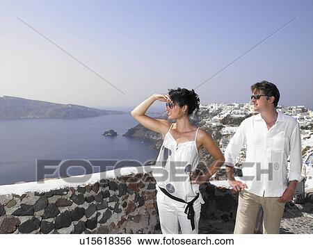Stock Photograph - Couple looking at the view. Fotosearch