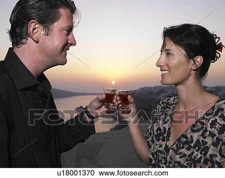 Man and woman toasting their glasses View Large Photo Image Stock Image - Man and woman toasting their glasses. Fotosearch