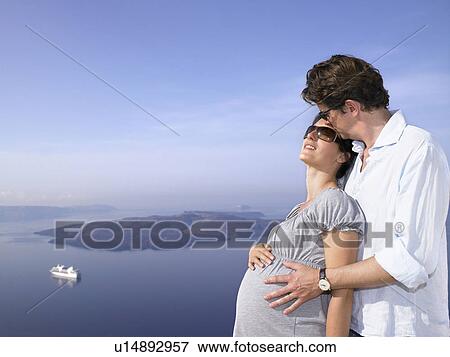 Pregnant woman and husband, sea view View Large Photo Image Stock Photo - Pregnant woman and husband, sea view. Fotosearch