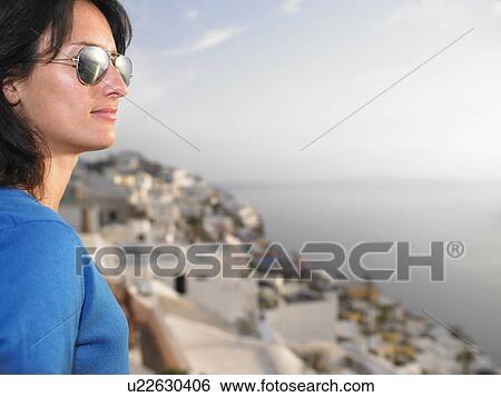 Stock Photograph - Woman contemplating a view. Fotosearch