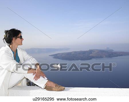 Stock Photography - Woman contemplating a view. Fotosearch