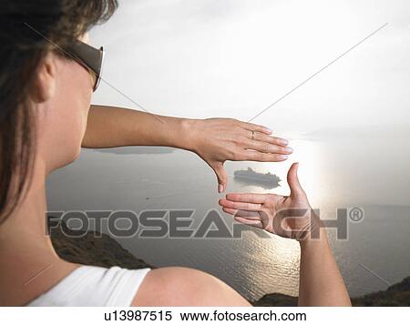 Woman framing a boat with her hands View Large Photo Image Stock Photography - Woman framing a boat with her hands. Fotosearch