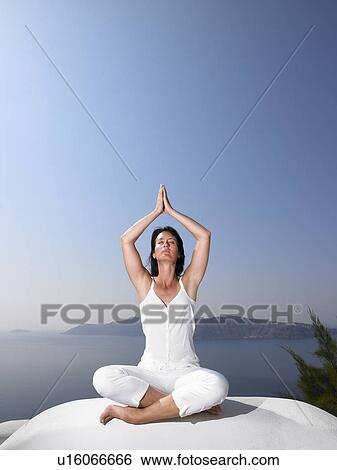 Woman in a yoga session View Large Photo Image Stock Photograph - Woman in a yoga session. Fotosearch