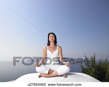 Stock Photography - Woman in a yoga session. Fotosearch