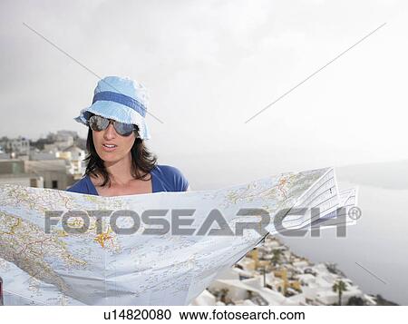 Woman looking at a map View Large Photo Image Stock Image - Woman looking at a map. Fotosearch