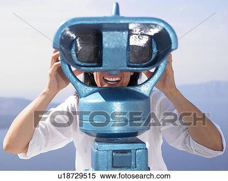 Woman looking through spyglasses View Large Photo Image Stock Photography - Woman looking through spyglasses. Fotosearch