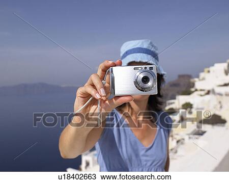 Woman taking a picture View Large Photo Image Stock Image - Woman taking a picture. Fotosearch