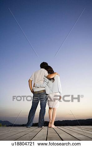 Couple being affectionate on a dock. View Large Photo Image Stock Image - Couple being affectionate on a dock.. Fotosearch