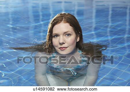 Portrait of a woman in a swimming pool. View Large Photo Image Stock Image - Portrait of a woman in a swimming pool.. Fotosearch