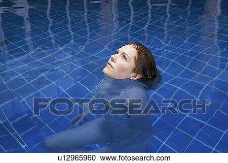 Woman in a swimming pool. View Large Photo Image Stock Image - Woman in a swimming pool.. Fotosearch