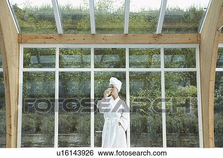 Woman wearing robe by pool. View Large Photo Image Stock Photograph - Woman wearing robe by pool.. Fotosearch