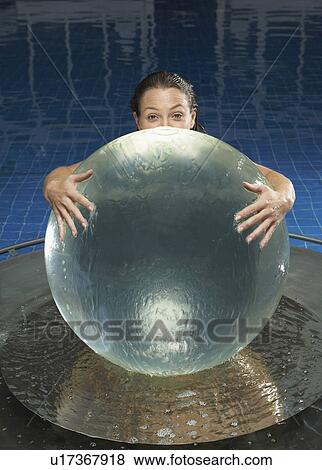 Woman with water globe in pool. View Large Photo Image Stock Photo - Woman with water globe in pool.. Fotosearch