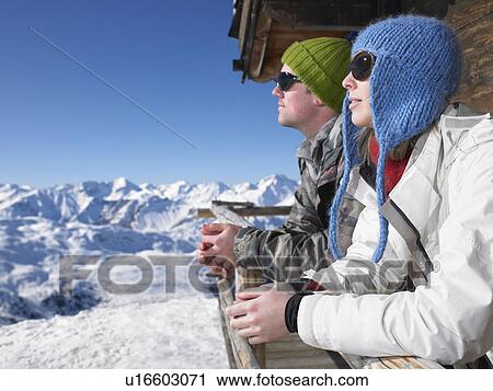 Couple admiring mountain view View Large Photo Image Stock Image - Couple admiring mountain view. Fotosearch